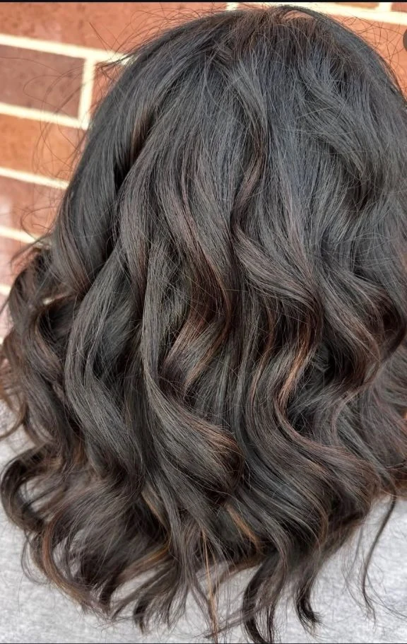 Glossy dimensional brunette hair by Stephanie Thomas at Gypsy Cosmo Salon
