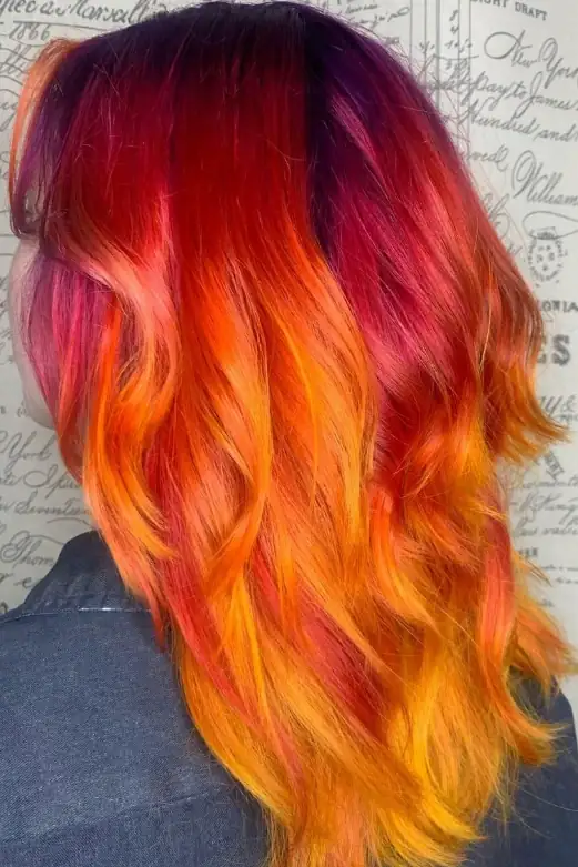 Vivid red, orange, and yellow fashion hair color