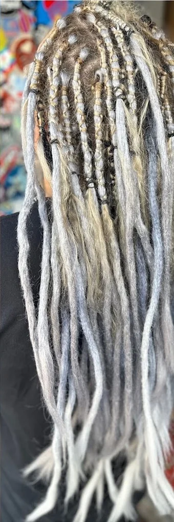 Long silver and blonde textured hair result by Gypsy Cosmo Salon